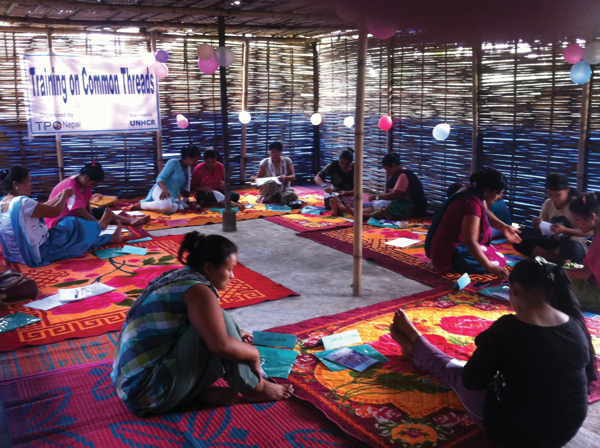 Women talk in small groups at a Sajha Dhago (“common threads” in Nepali) circle in Nepal.
