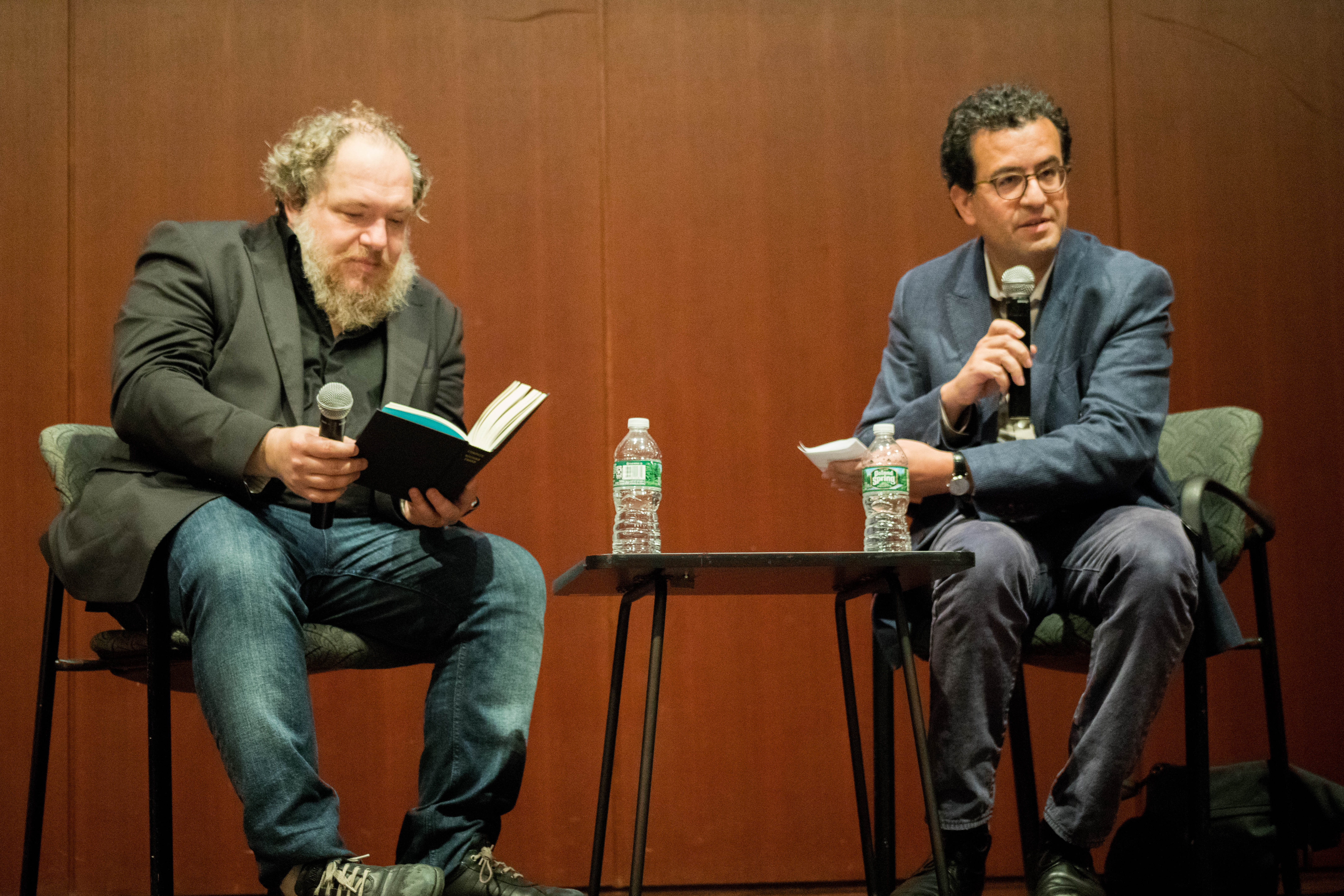 Mathias Énard and Hisham Matar sitting next to each other on a stage