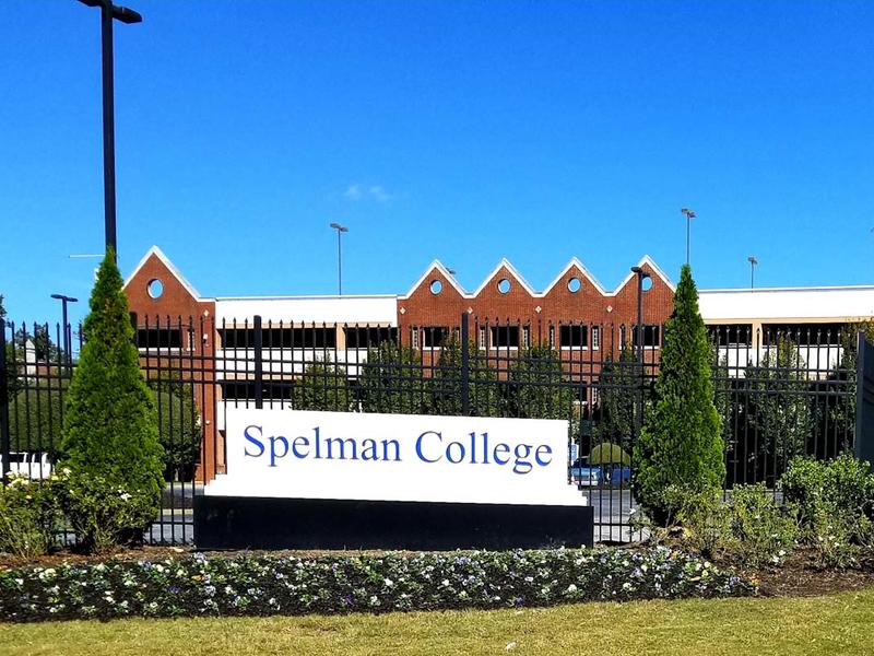 Spelman College campus sign on a sunny day